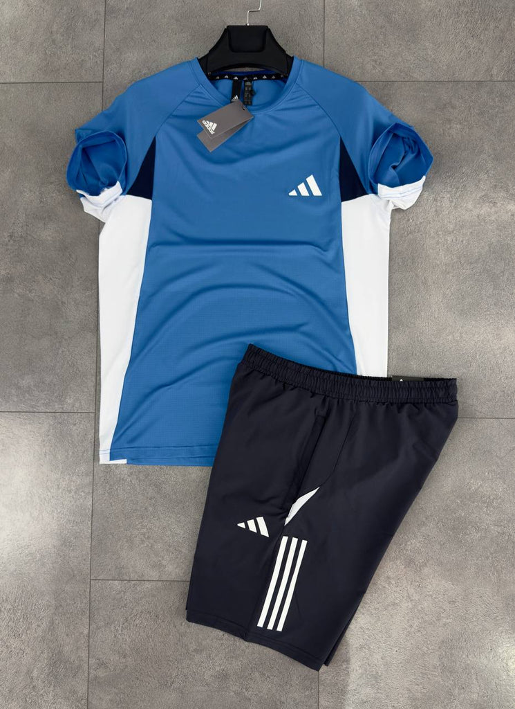 Moški komplet Adidas, sestavljen iz črnih kratkih hlač in modre majice. Vrhunska kakovost.