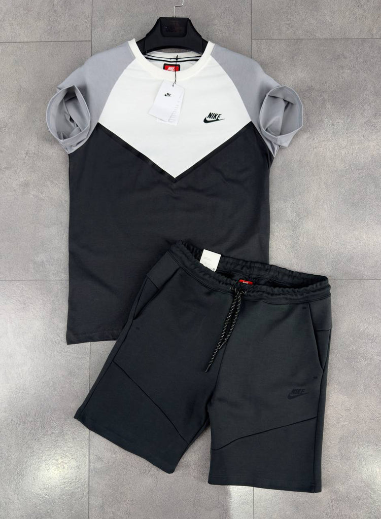 Moški komplet Nike Tech Fleece, sestavljen iz črnih kratkih hlač in bele, sive in črne majice s kratkimi rokavi. Vrhunska kakovost.